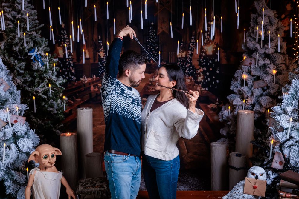 Whimsical winter wonderland setup with hanging icicle lights and decorated Christmas trees.
