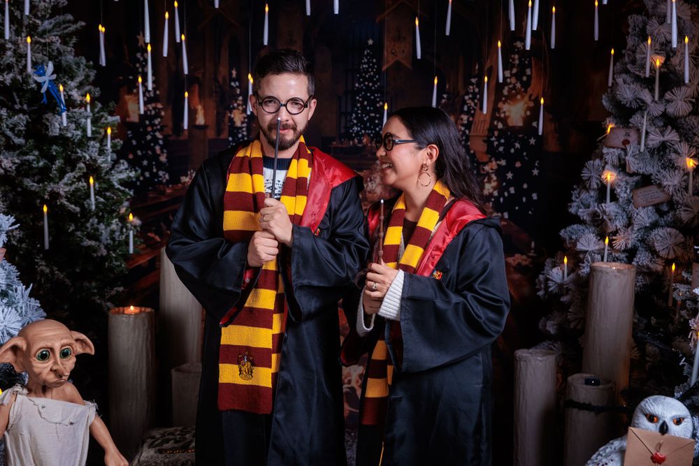 Holiday themed photoshoot featuring Harry Potter inspired scarves and magical winter decor.