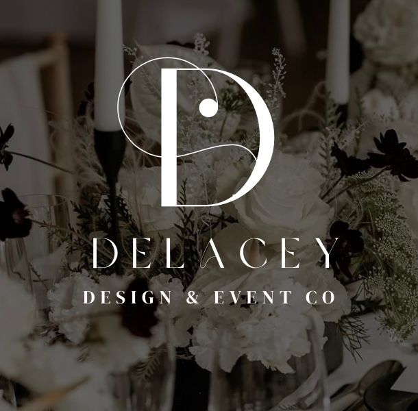 Elegant black and white logo for Delacey Design & Event Co with white floral arrangements in the background.