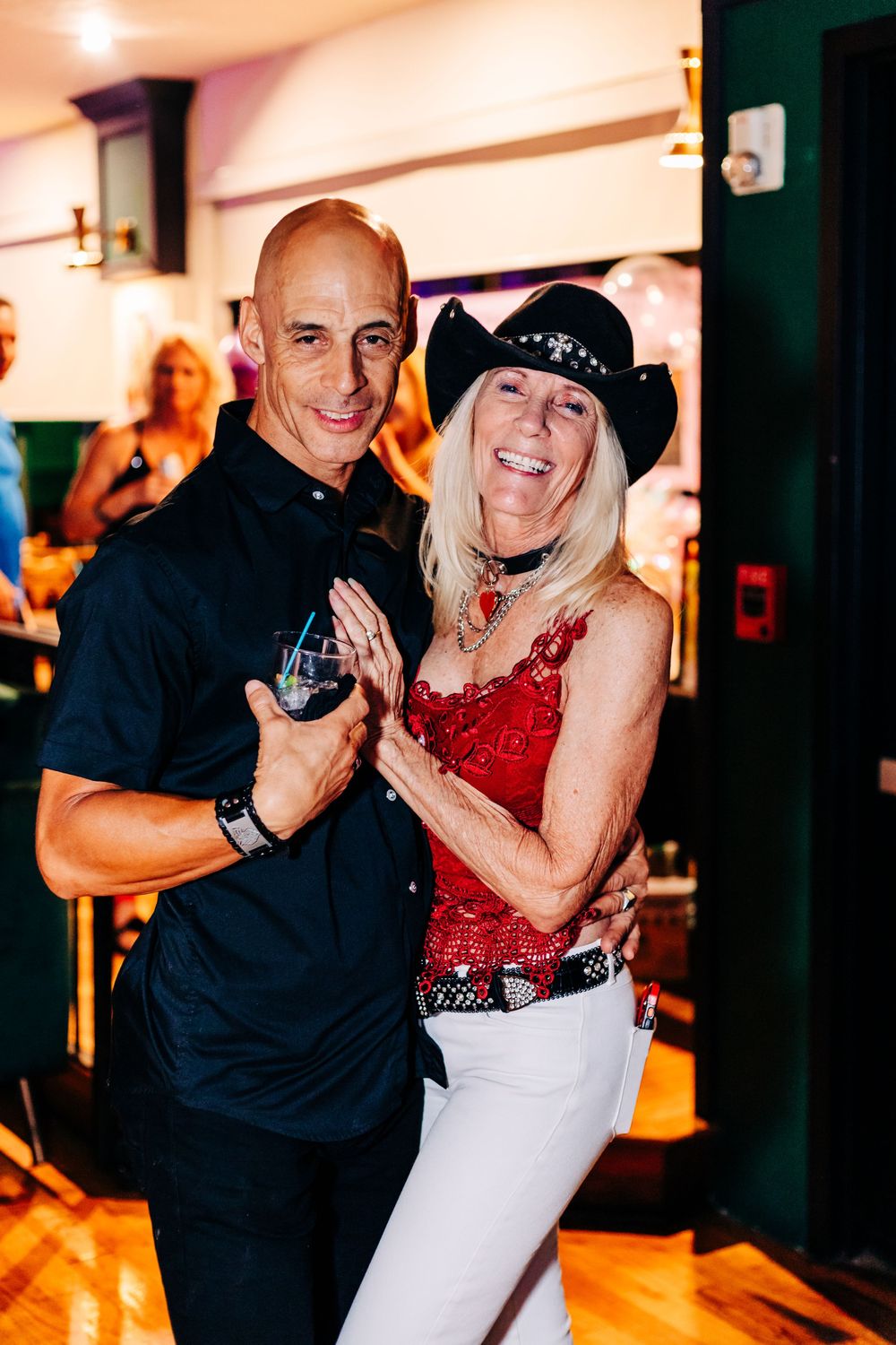 Dancing couple in western attire enjoying themselves at a party venue at an event in lake worth.
