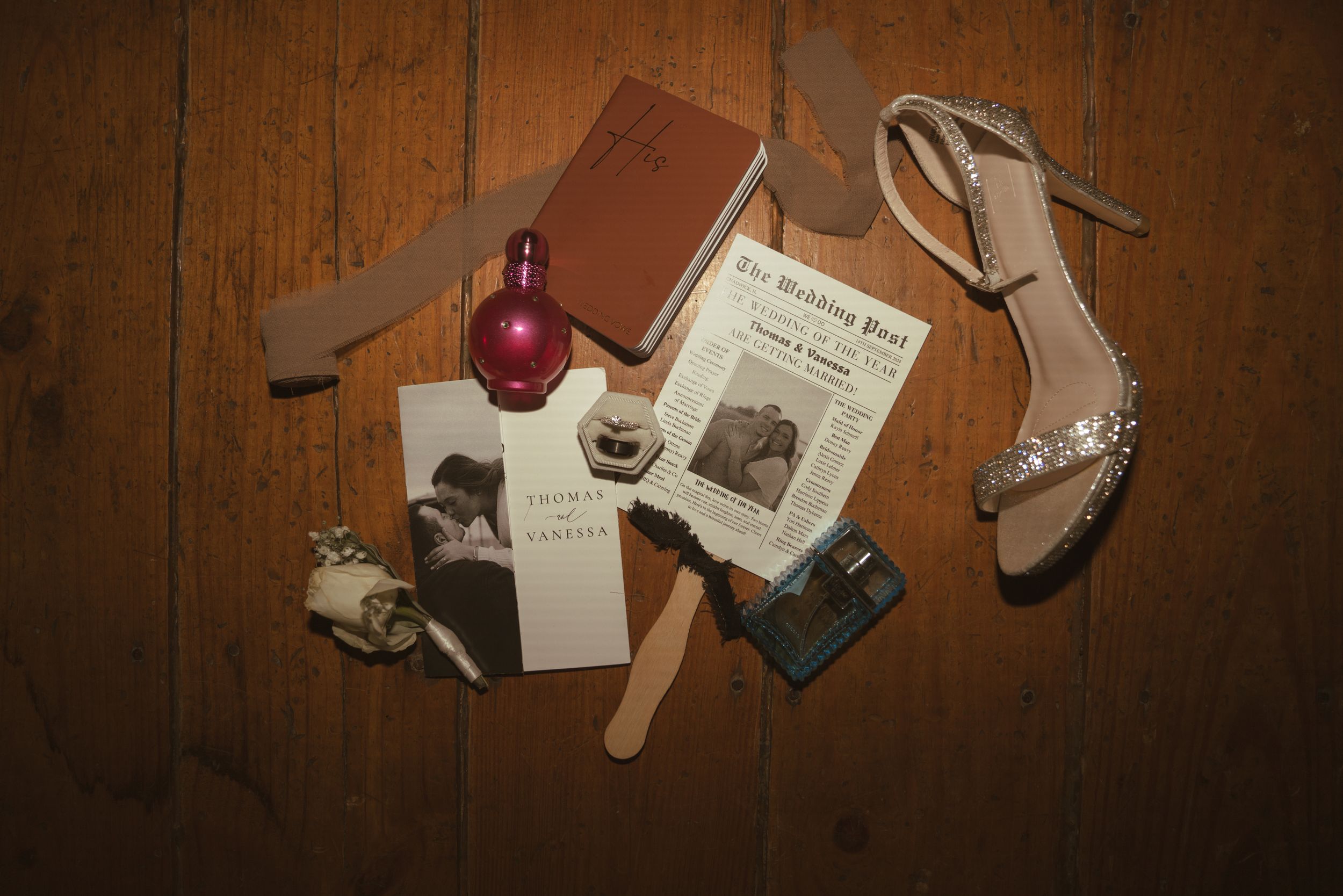 Vintage wedding memorabilia and decorative items arranged on wooden surface.