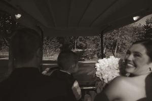 Black and white wedding photo captures intimate moment between couple.