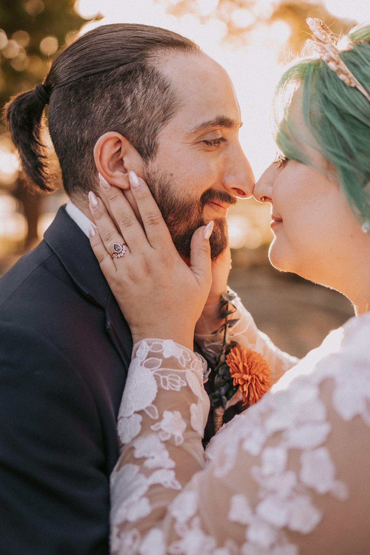 Romantic golden-hour wedding portrait shows intimate moment between newlyweds with delicate lace details at Albuquerque Garden Center.