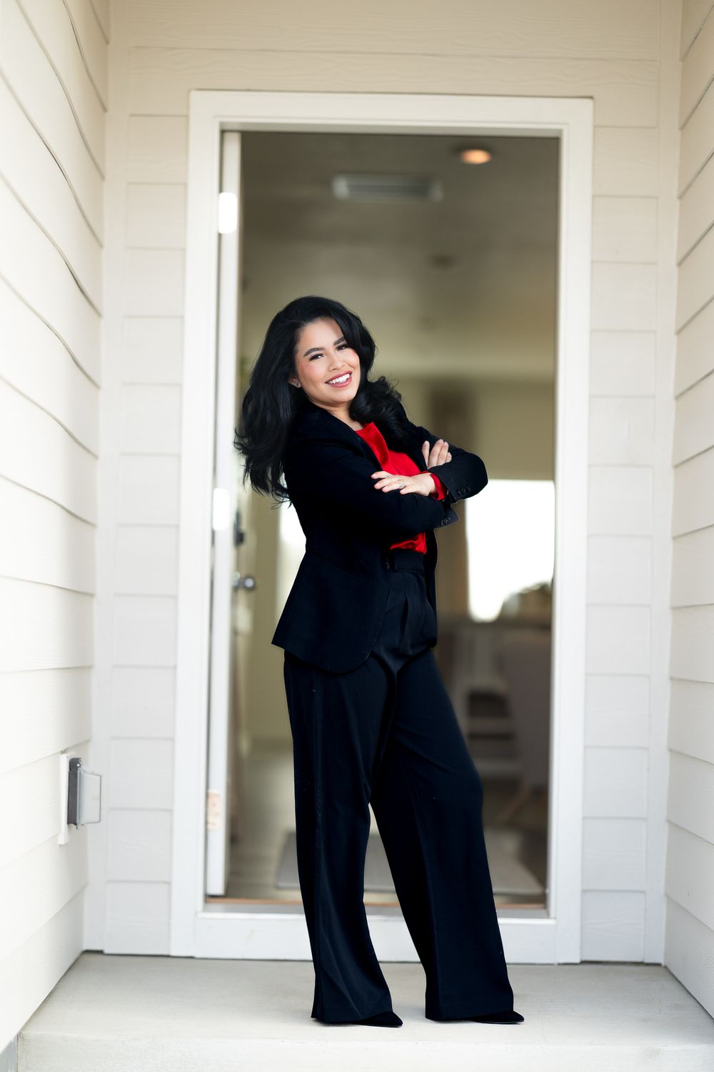 real estate agent business branding photoshoot posing outside sold home