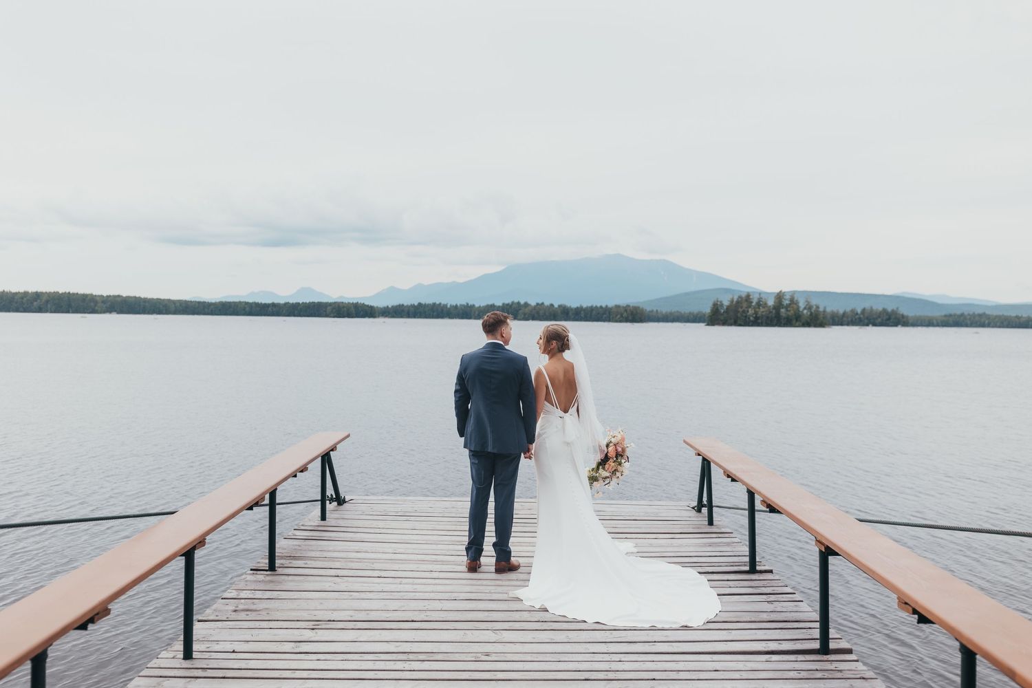 Scenic lakeside dock photos with mountain views in the background.