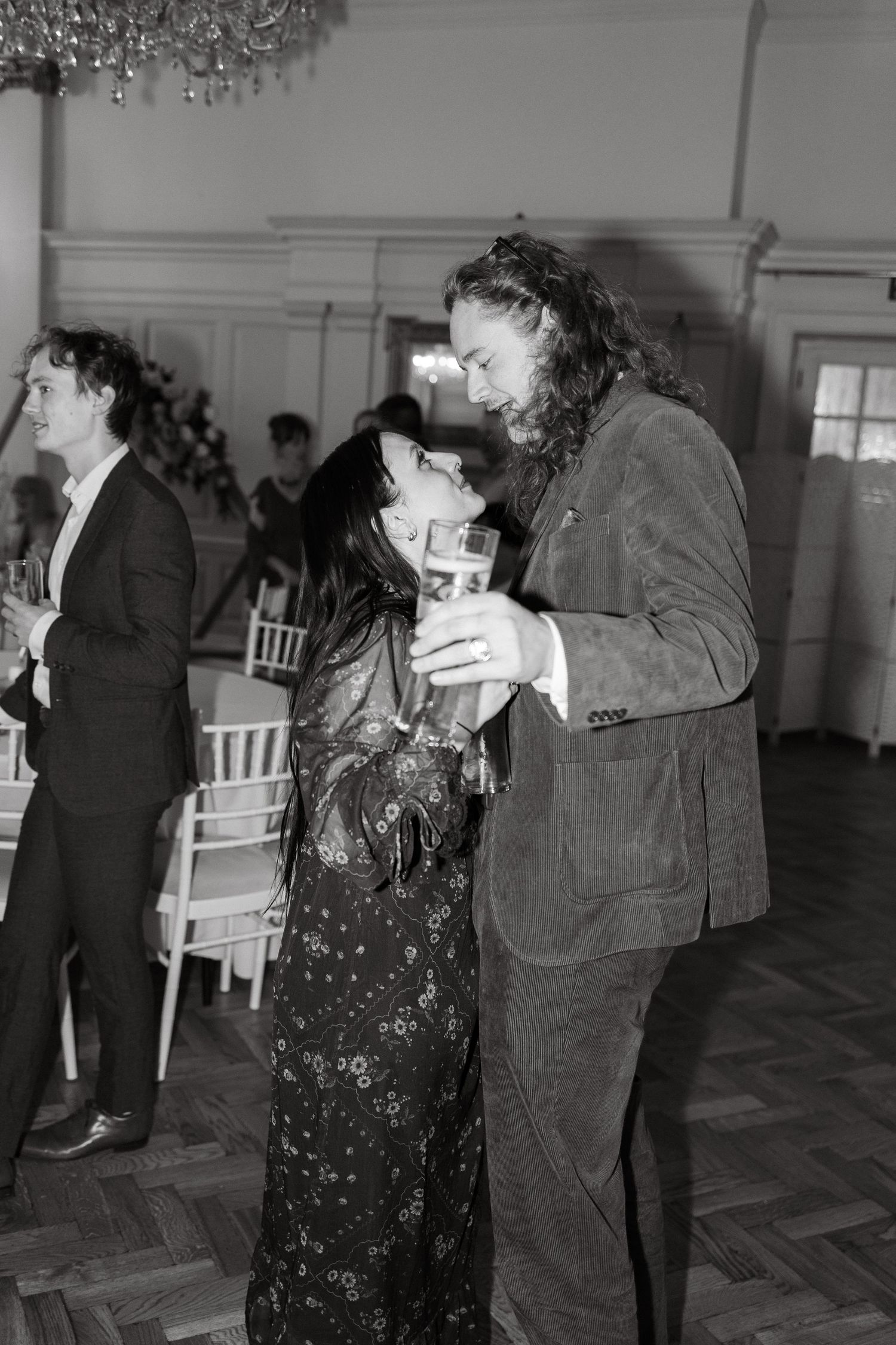 Vintage black and white photo of couples dancing at a formal event.