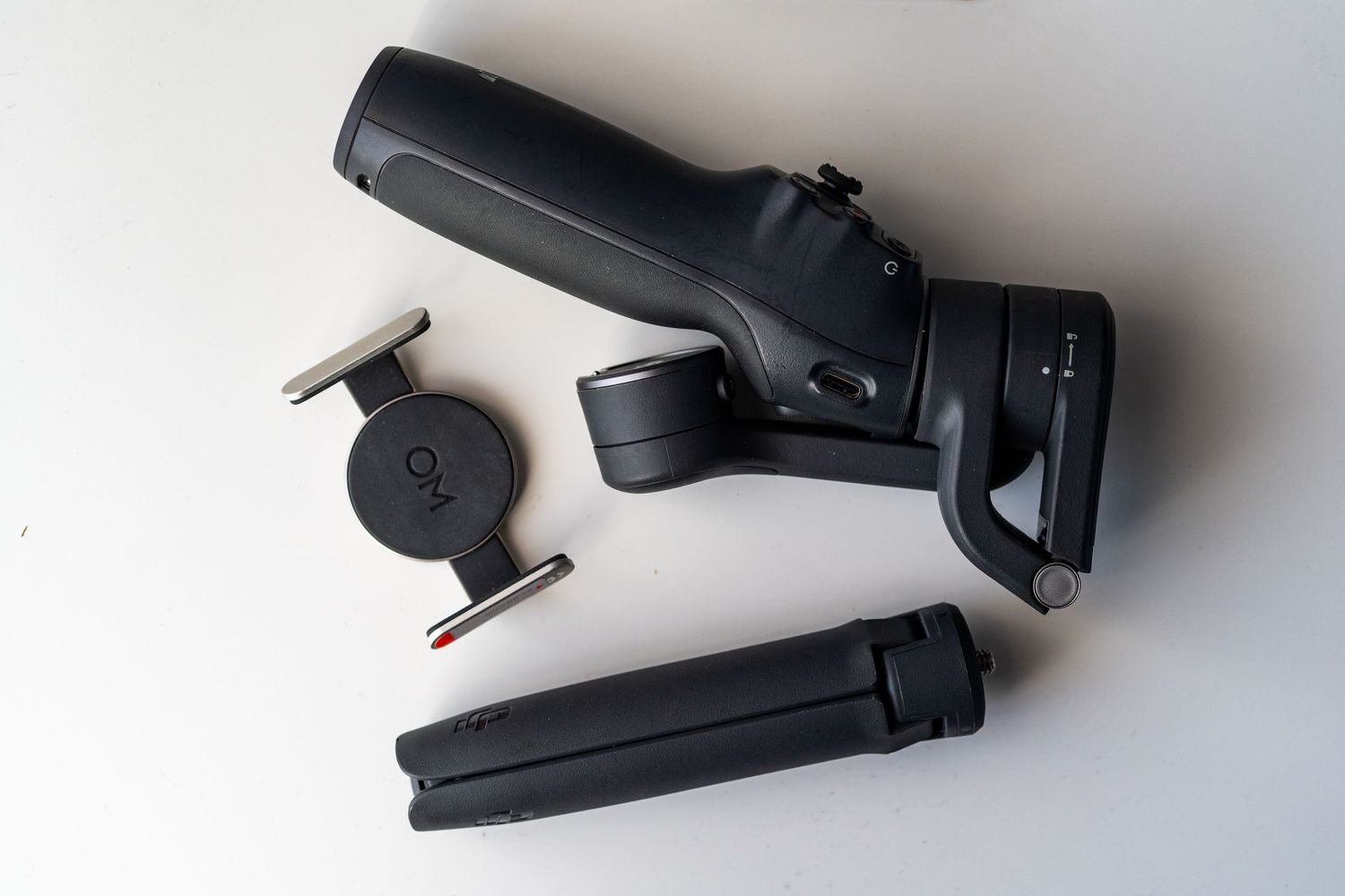 Black staple remover tool shown from multiple angles on a white background.