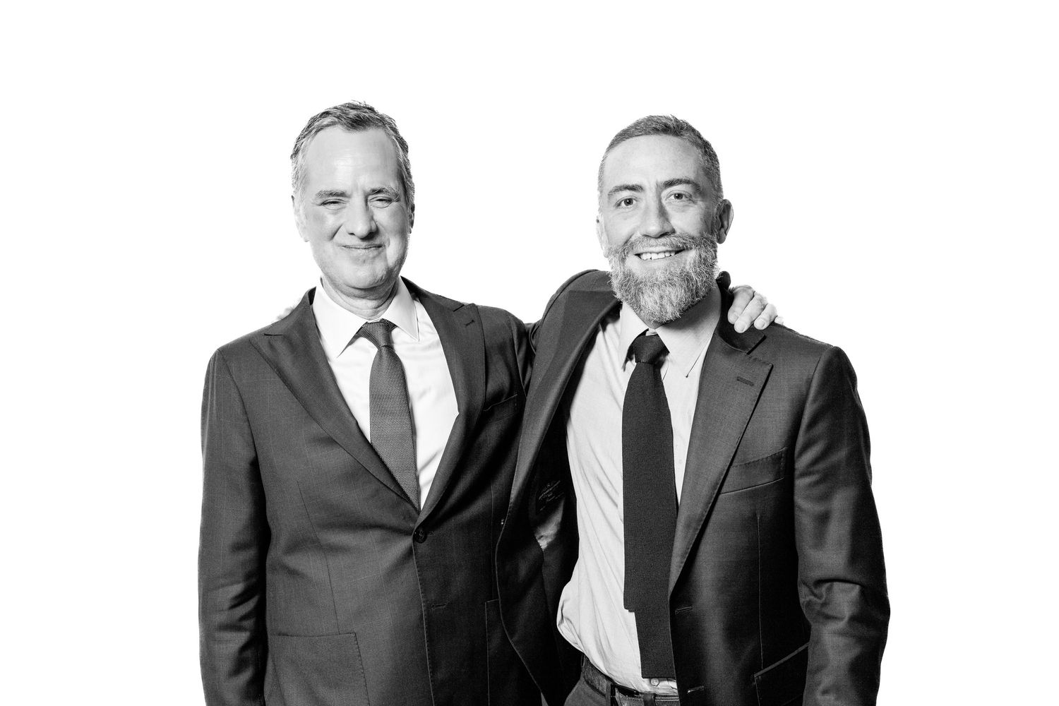 Wedding party members posed in black and white formal portrait.