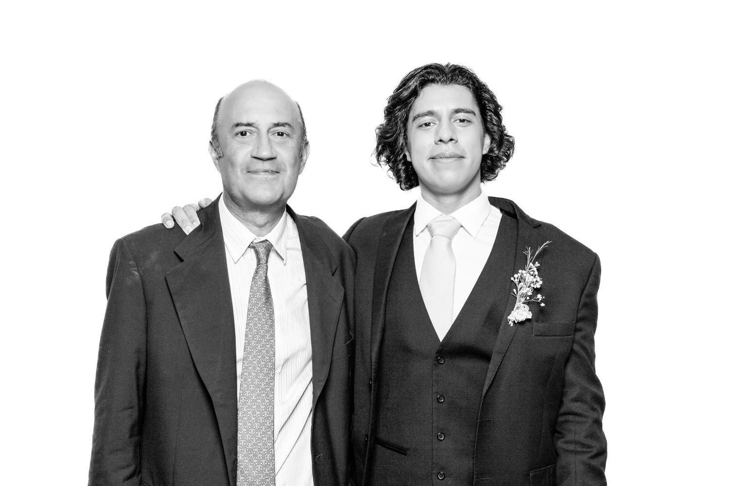 Professional black and white photo of business colleagues in suits posing together.