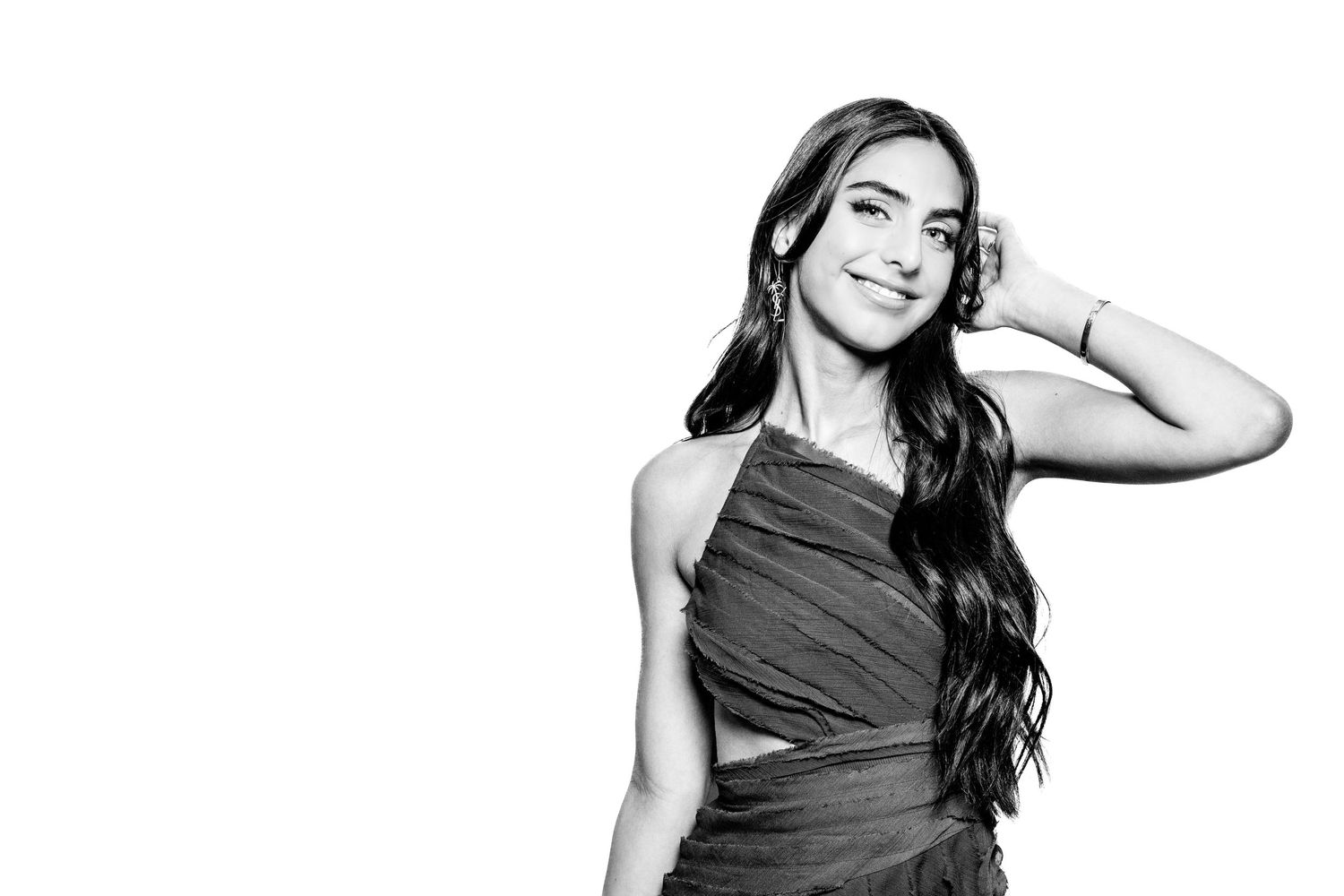 Stylish black and white photo of a woman in an elegant dress striking different poses.