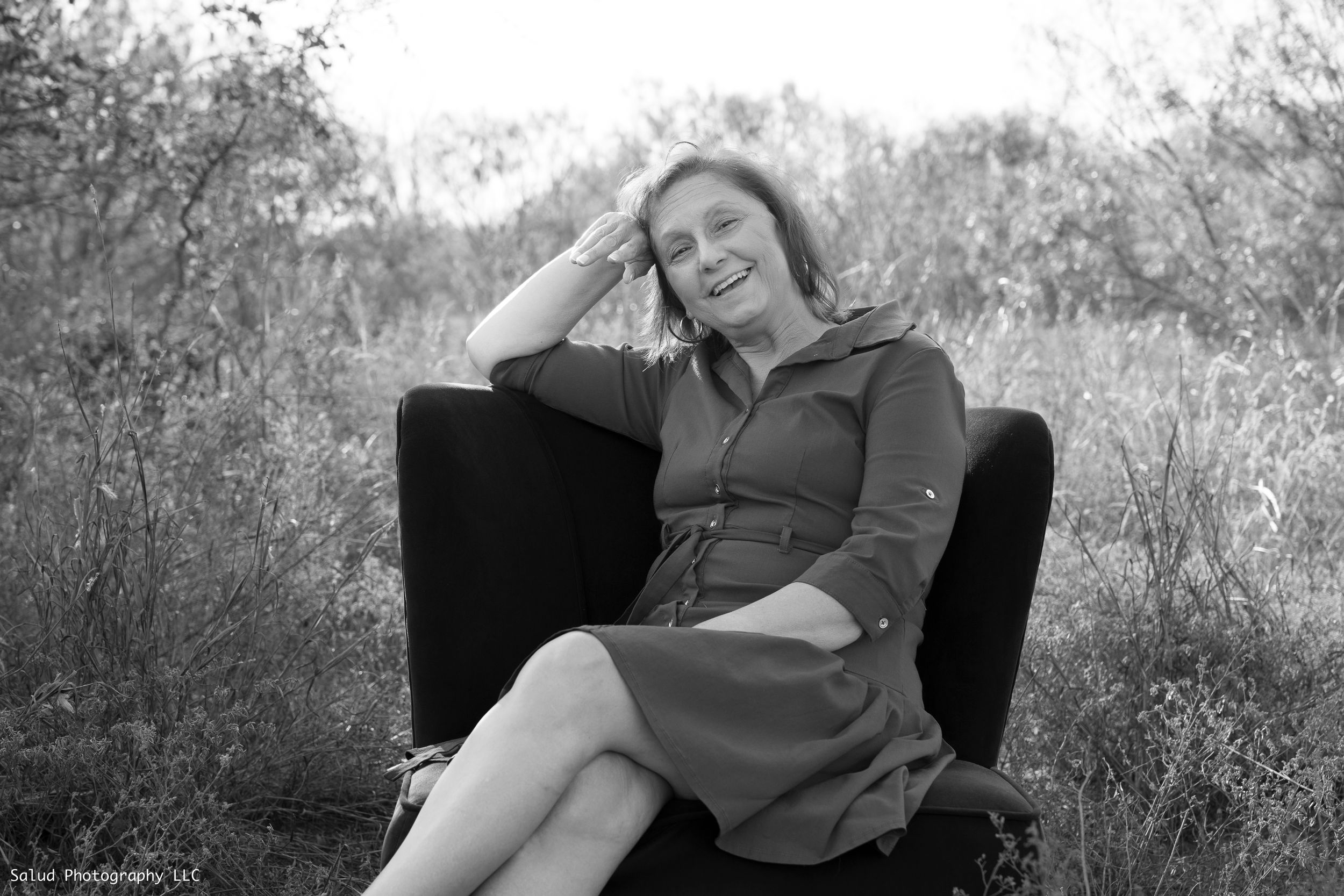 Black and white portrait series of person reclining on dark chair.