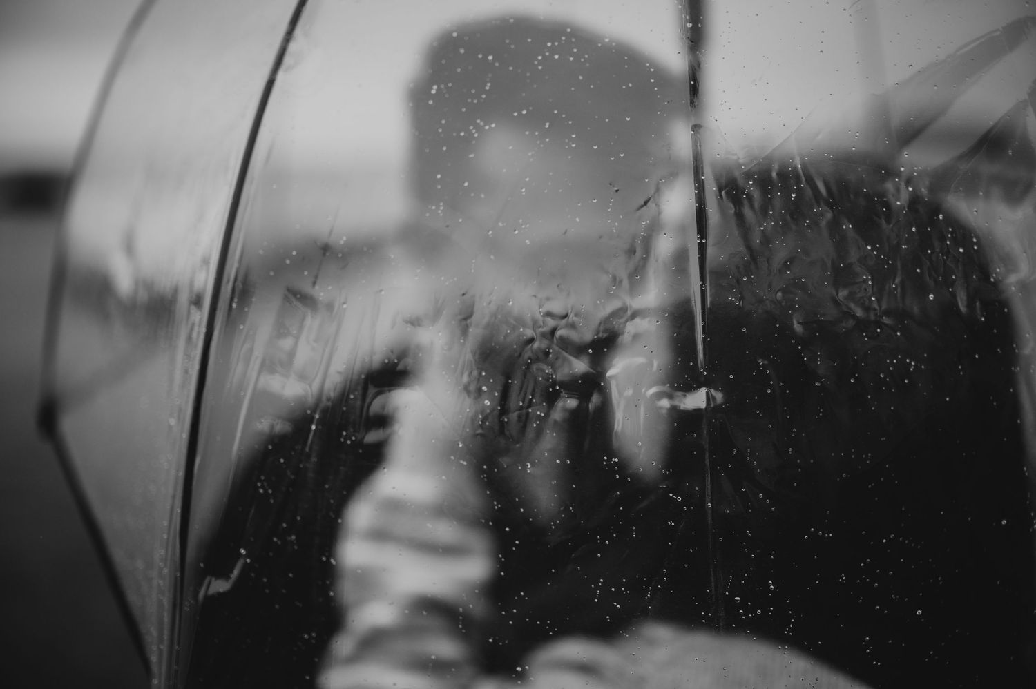 Neck Point Park, Nanaimo, Vancouver Island Engagement Photographer Photoshoot of couple under umbrella holding each other
