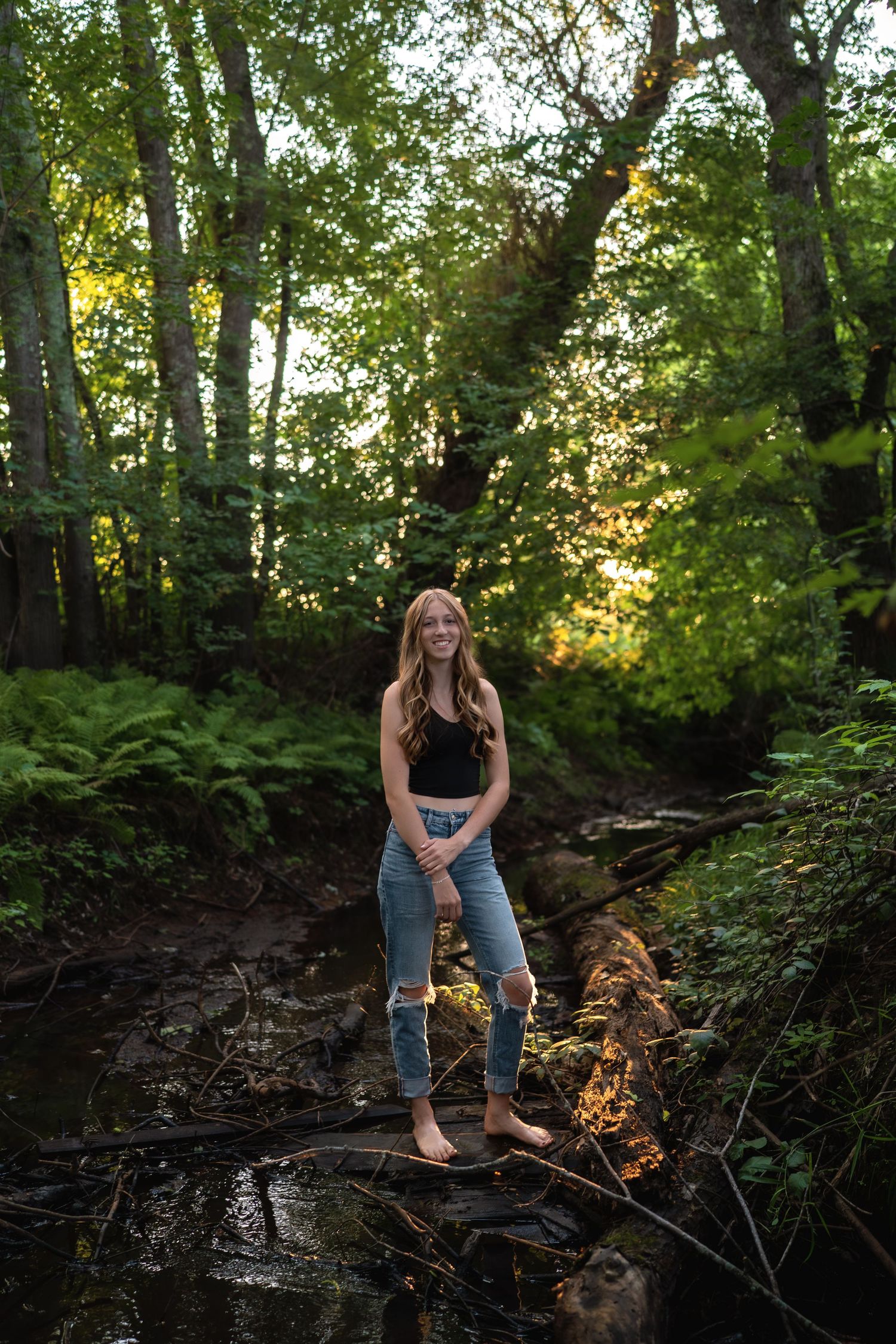 A sequence of outdoor photos taken in a wooded area with sunlight filtering through trees.