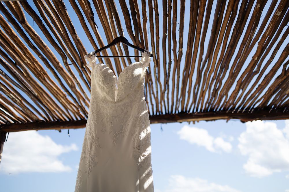 A bamboo roof covering provides natural shade over an outdoor patio or terrace area.