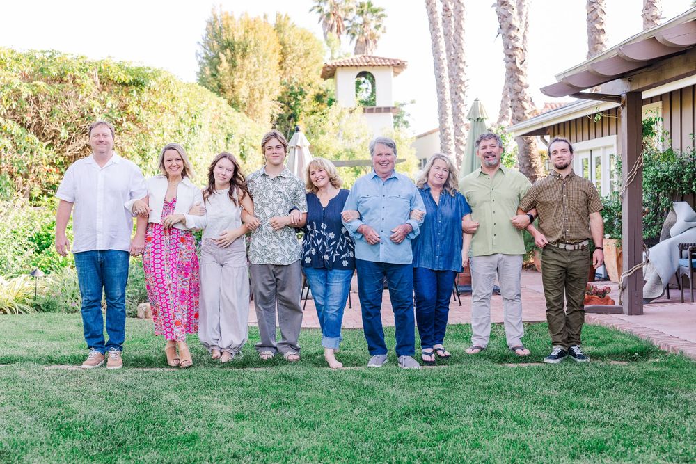 A series of outdoor family portraits arranged in a collage showing casual group poses on grass and walkways.