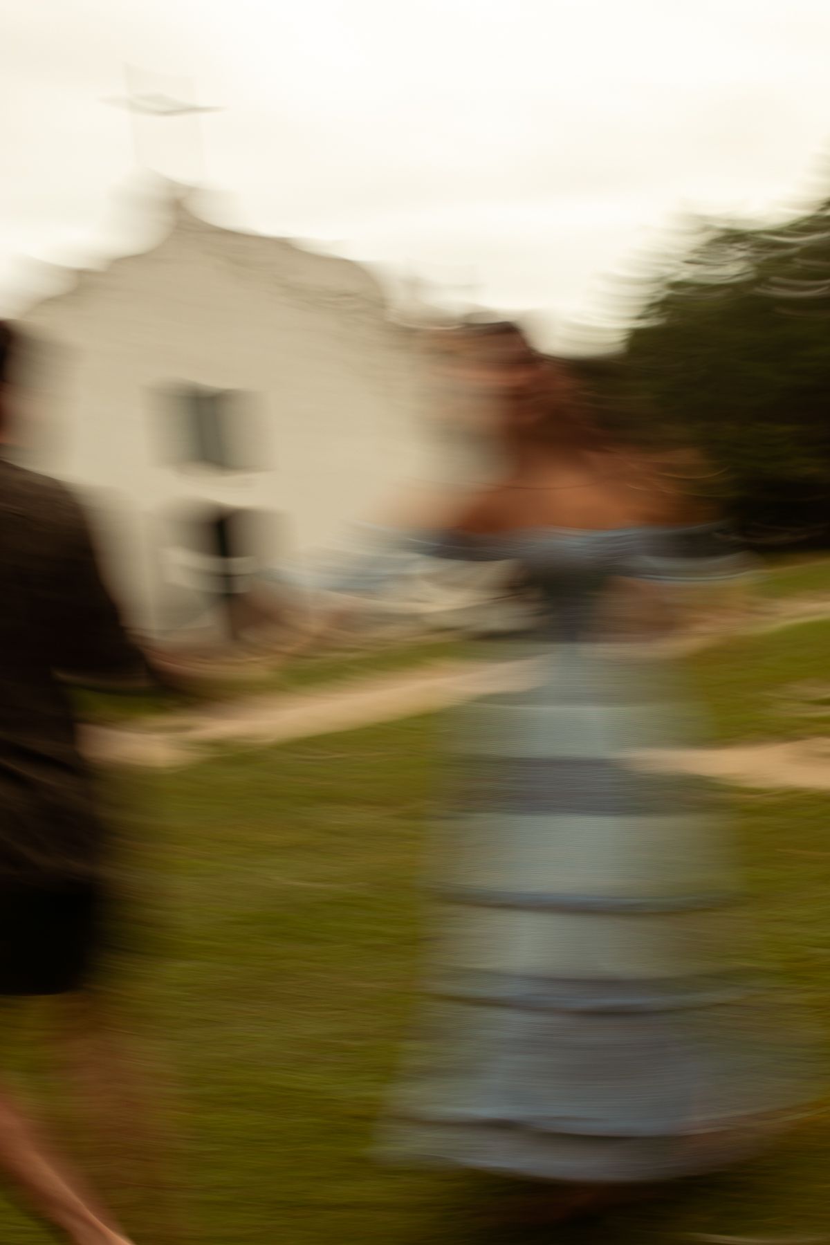 A motion-blurred sequence shows a person in a light blue dress spinning or twirling in a garden setting.