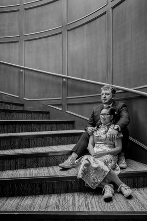 A sequence of black and white photos showing someone reclining on stairs in different relaxed poses.