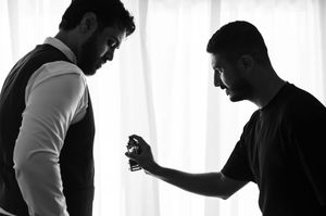 A series of black and white silhouettes against a white background show a person drinking from a cup.