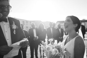 A series of black and white wedding reception photos showing joyful dancing and celebration moments.