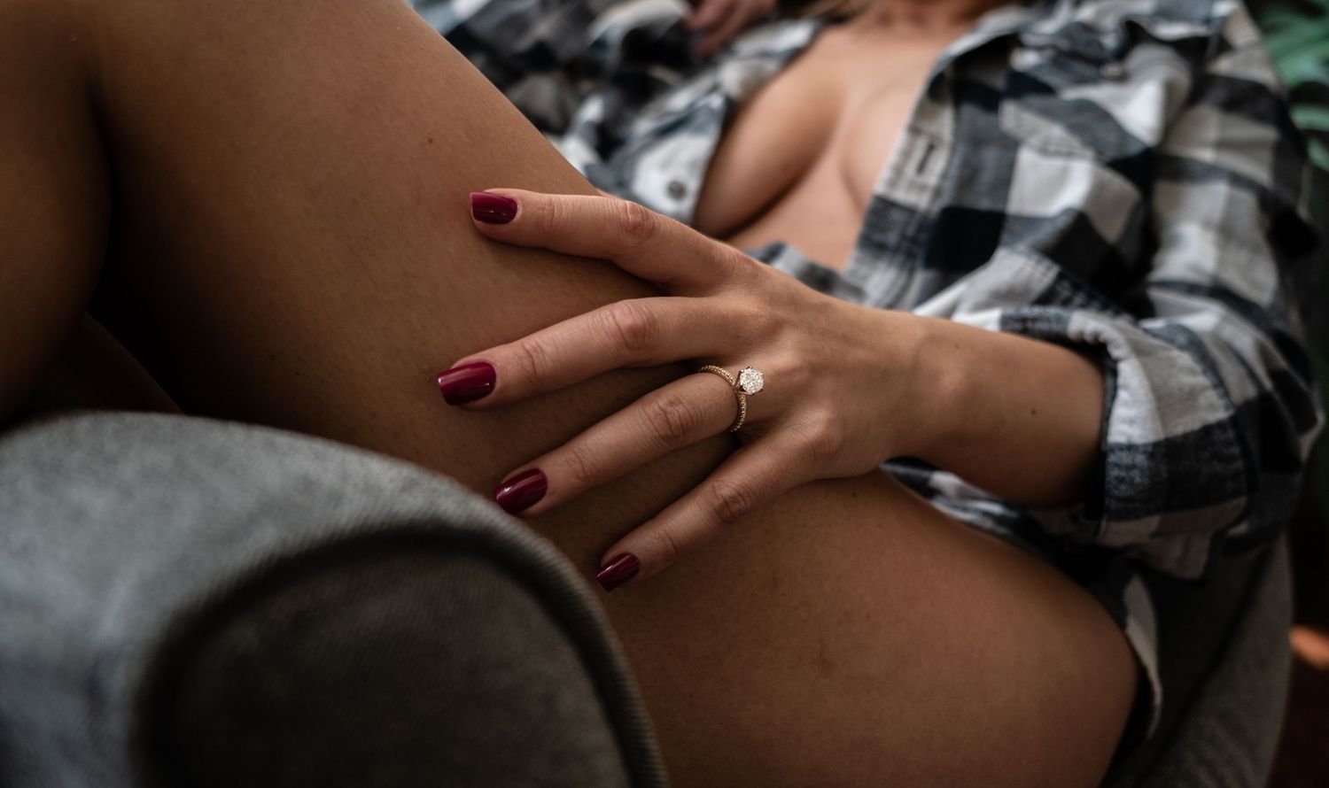 A close-up view of hands with an engagement ring in a romantic outdoor setting. Leavenworth, WA