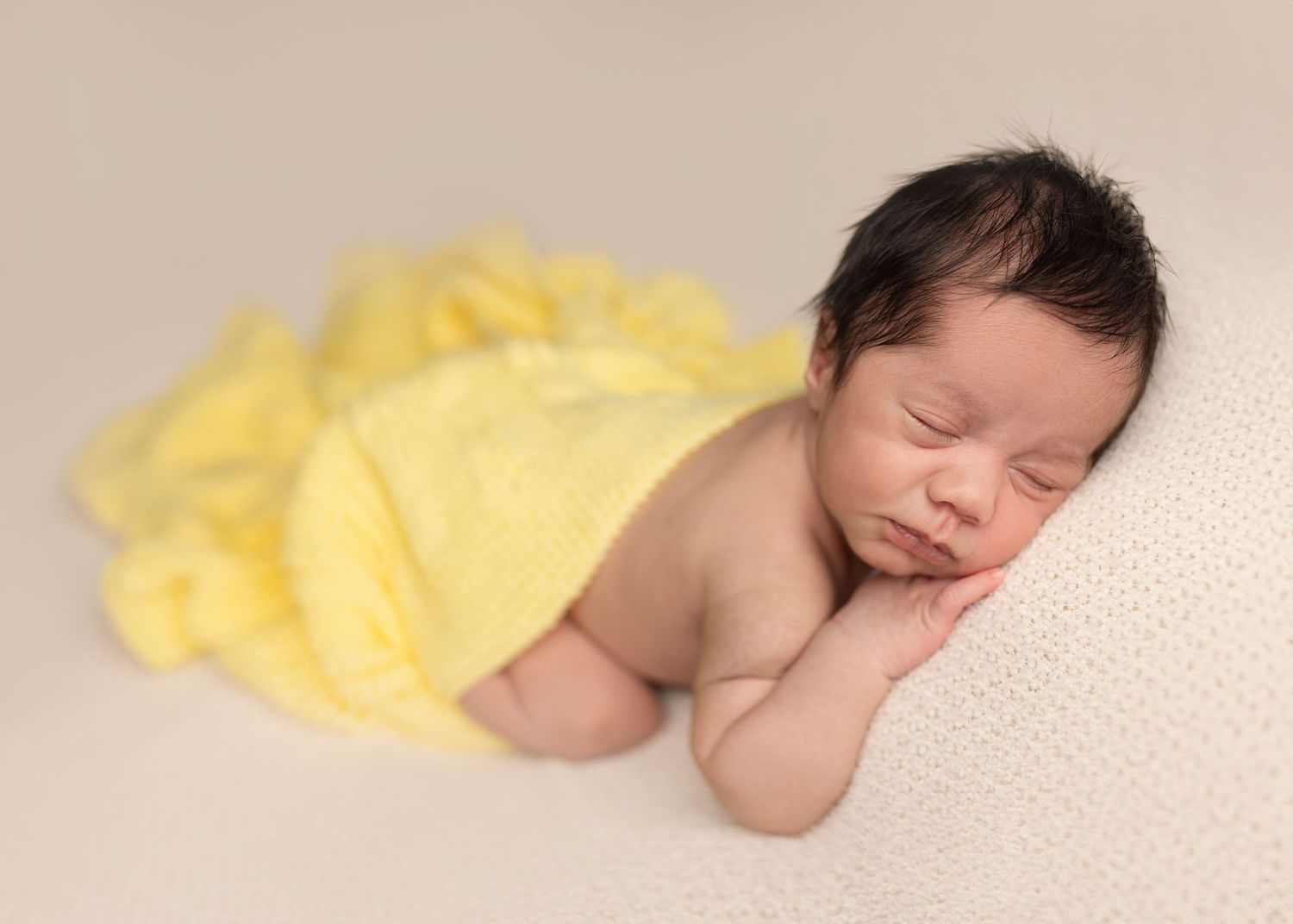 Newborn baby boy poses for newborn photos studio Elizabeth Lang Photography Surrey Cloverdale. Yellow blanket