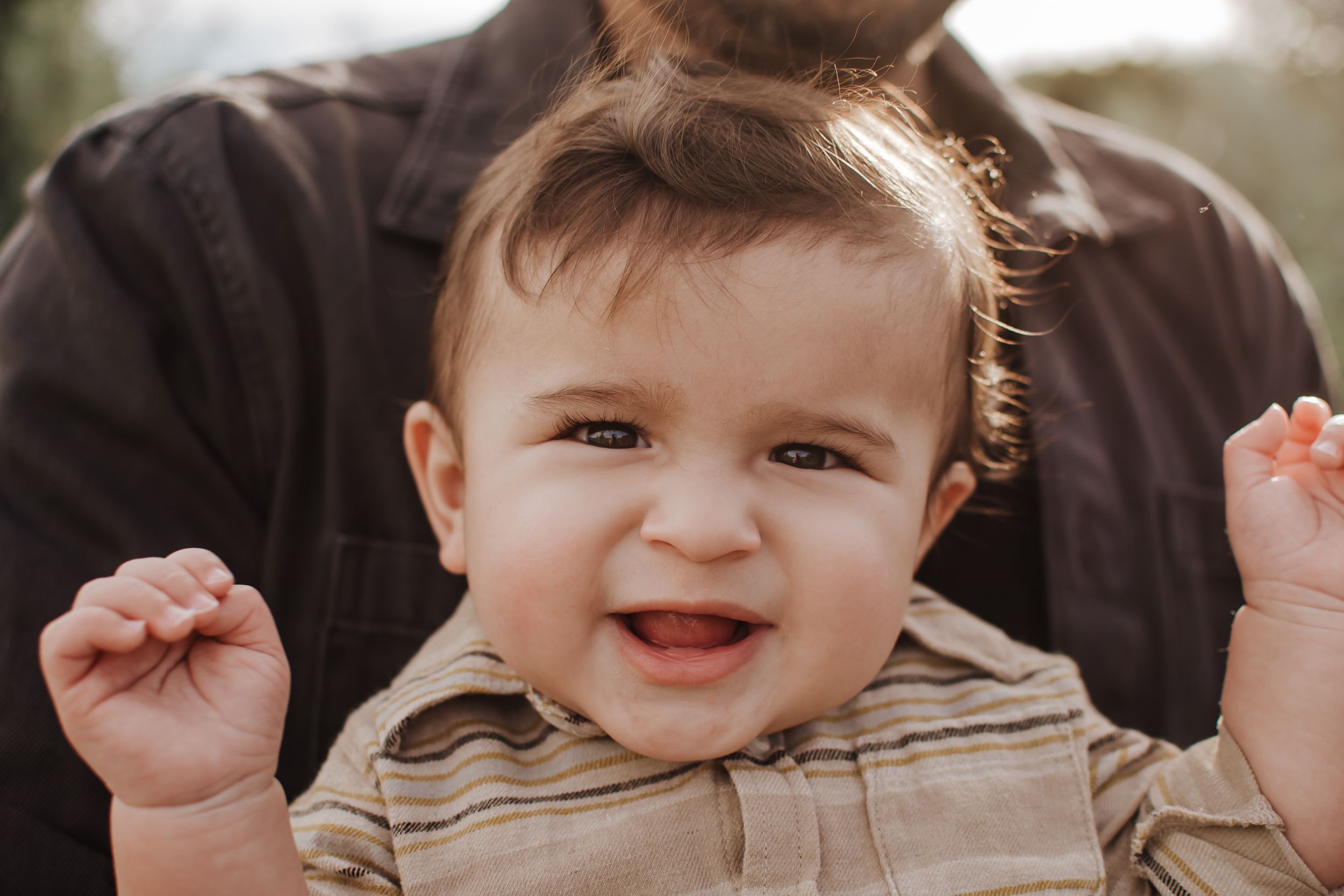 Close-up shots capturing joyful expressions during a family photo session.