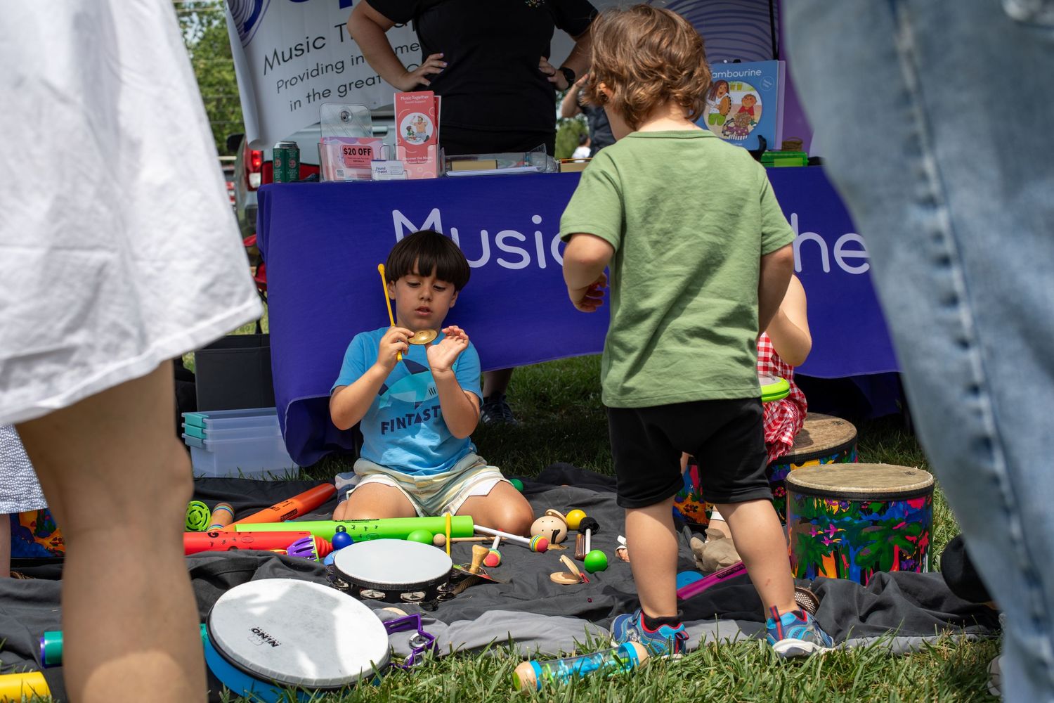 Kidchella Cincinnati event photo of child playing with interactive activities for high-end family audience