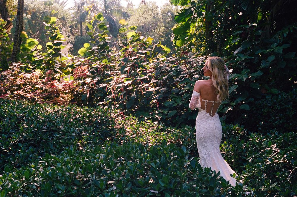 A series of romantic outdoor engagement photos taken in a lush garden setting with golden sunlight filtering through trees.