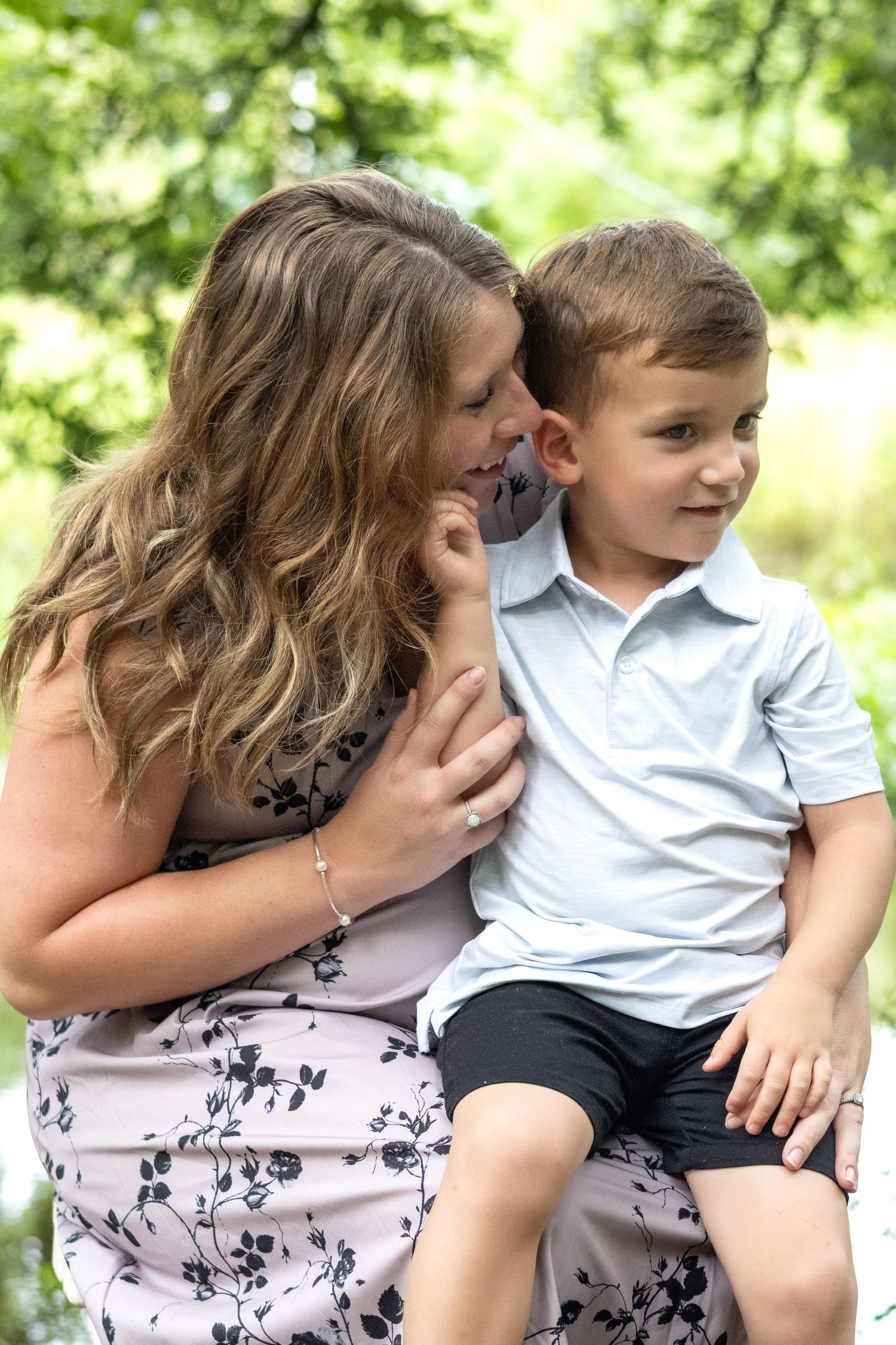 Tender family portrait sequence captured in natural outdoor lighting.