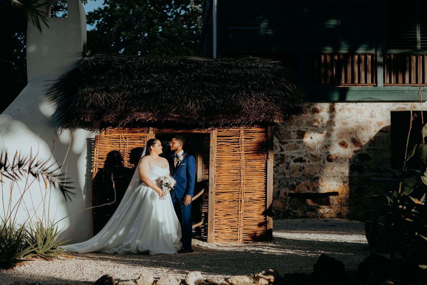 Rustic outdoor wedding venue with wooden decorations and natural lighting.