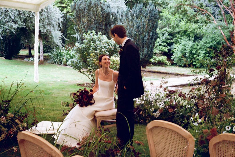 Candid moment of Bride & Groom smiling in conversation. Documentary wedding