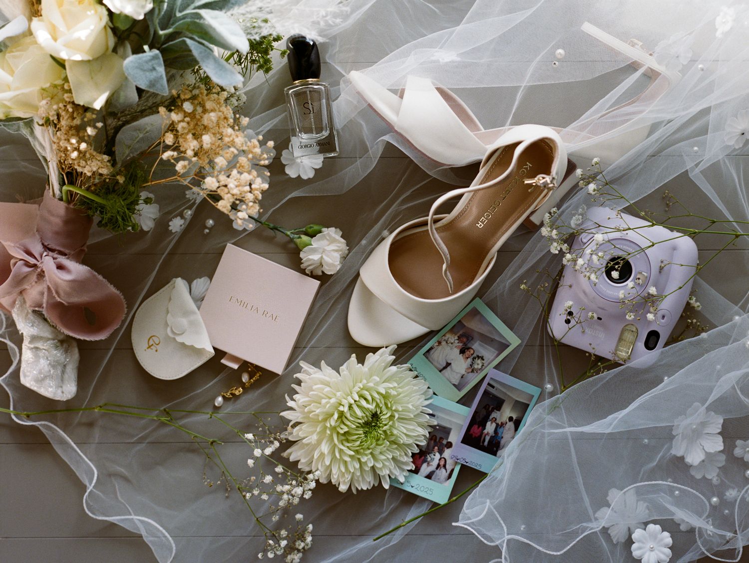 Wedding details include bride's shoes, instax mini 12, veil, accessories and bouquet