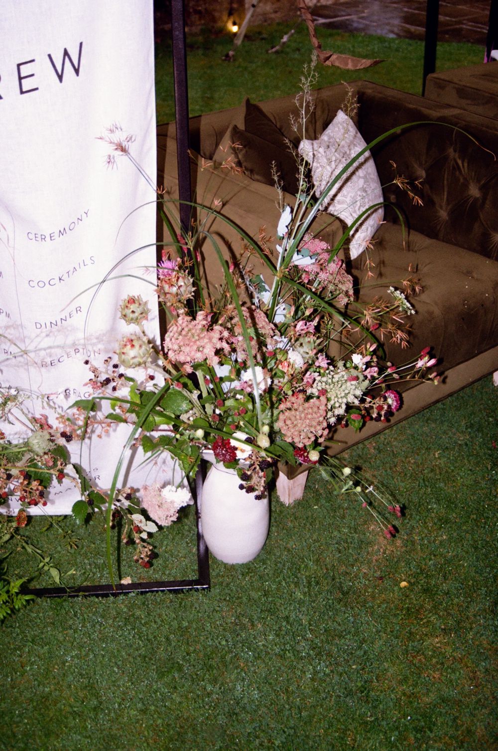 Wedding florals beside a name stand