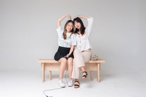 A collection of fashion photography shots showing someone seated on a wooden chair against a white studio background.