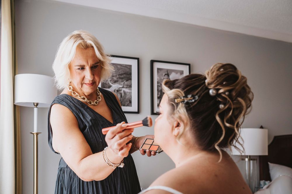 A series of wedding preparation photos showing the final touches of hair and makeup being done before the ceremony.