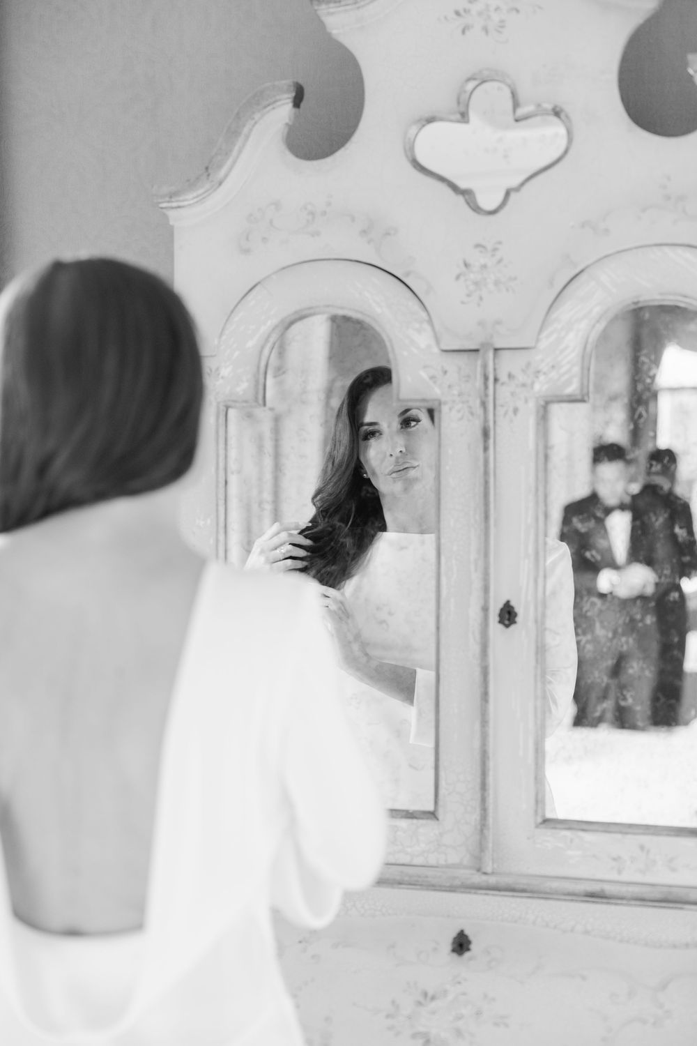 A sequence of black and white artistic photographs showing abstract reflections in mirrors with geometric shapes.