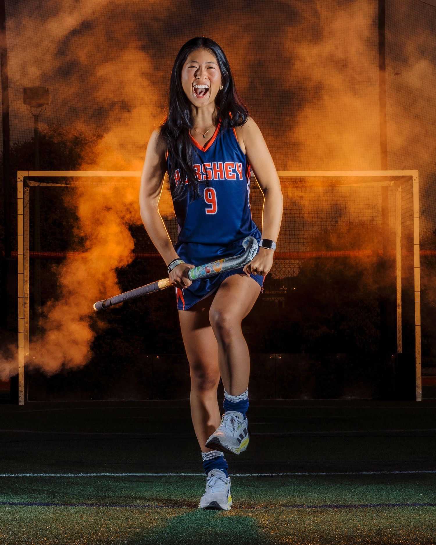 Hershey Trojans field hockey player Media Day portrait with gold light frame and smoke, by Deanna Fox, SportsFox Photography, Hershey PA