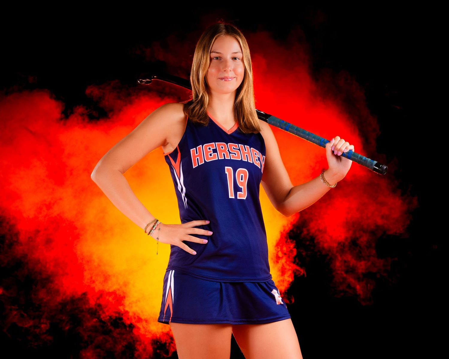 Hershey Trojans field hockey senior, #19, Media Day portrait with smoke, by Deanna Fox, SportsFox Photography based in Hershey PA