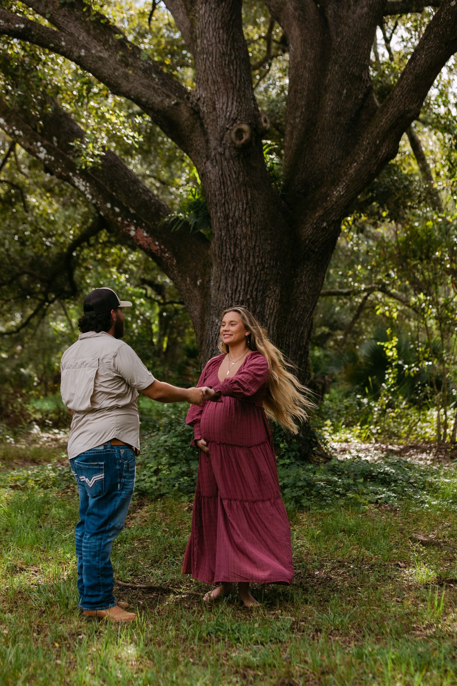 Candid Fort Myers maternity photography of Eric and Taylor celebrating parenthood with soft, natural light and warm tones.
