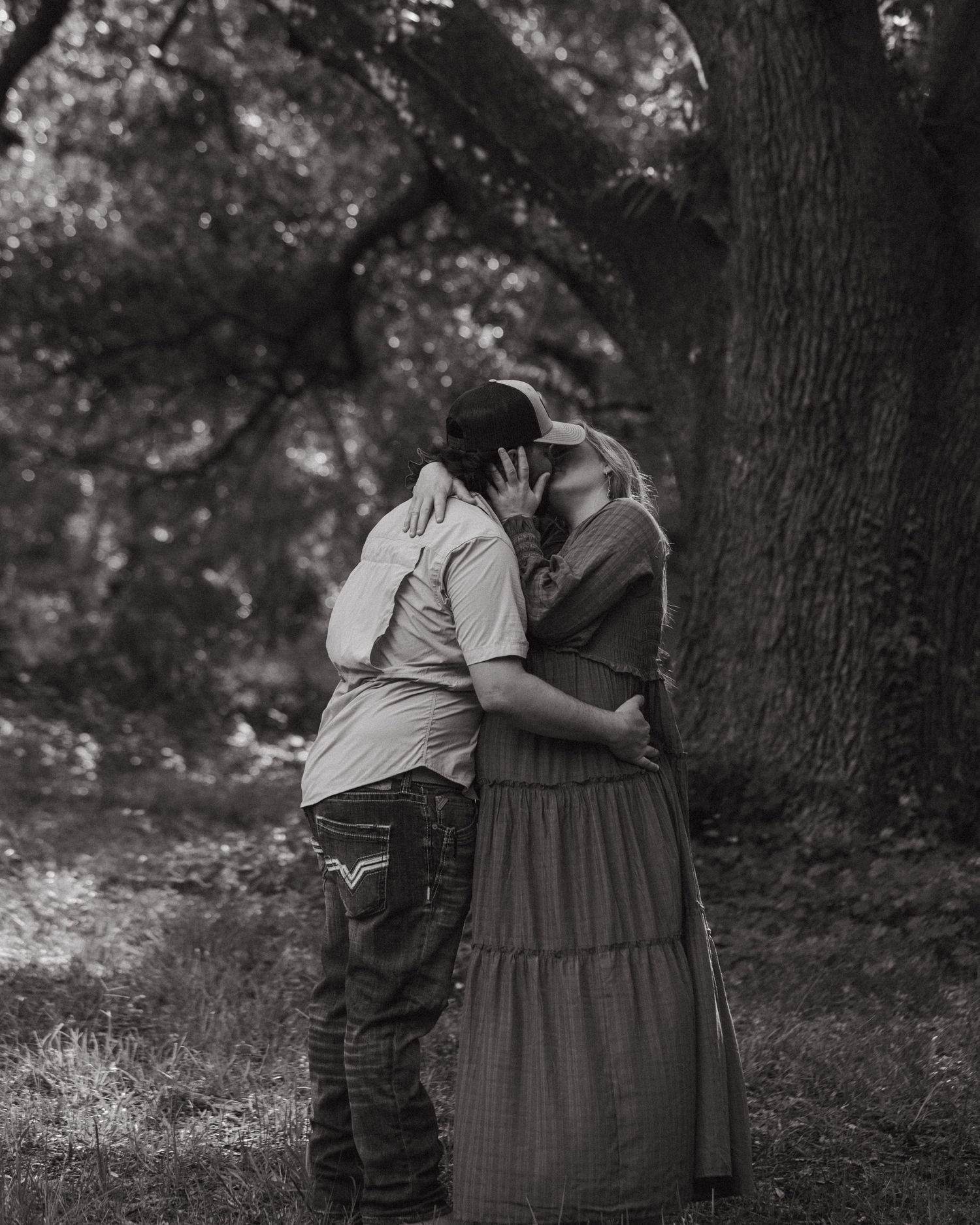 Candid Fort Myers maternity photography of Eric and Taylor celebrating parenthood with soft, natural light and warm tones.