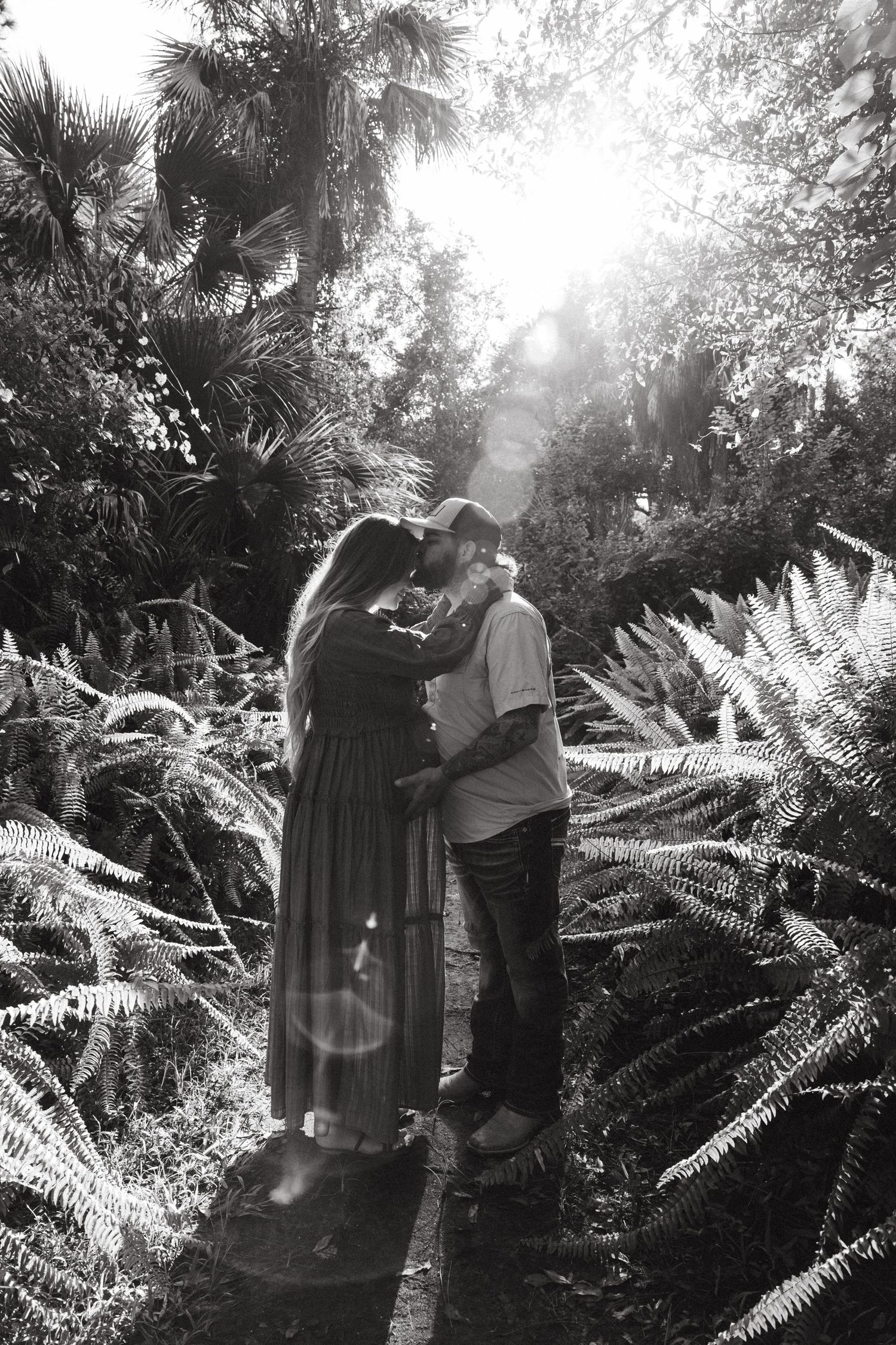 Fort Myers maternity session with Eric and Taylor captured in warm golden light and natural, candid family moments.