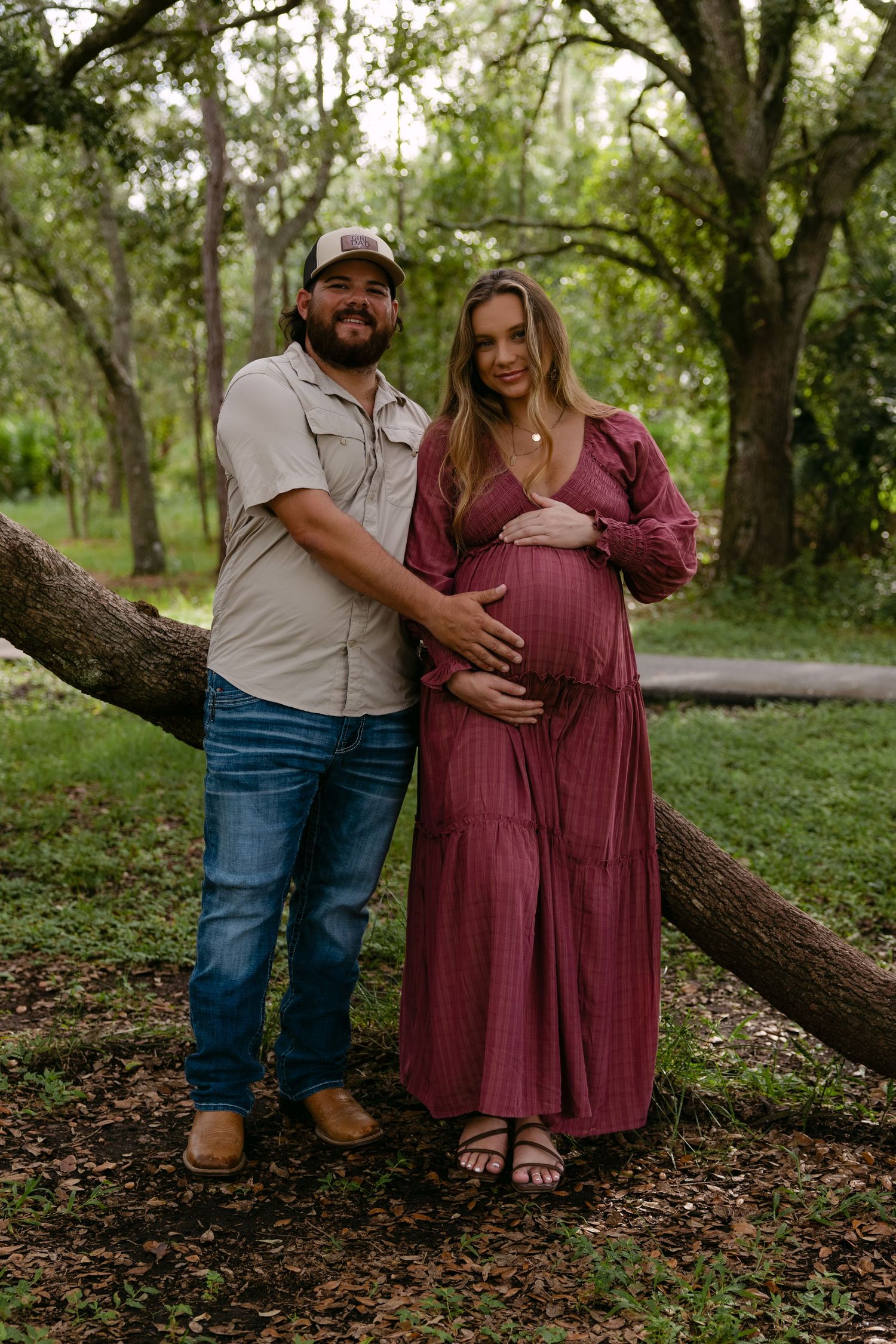 Fort Myers maternity session with Eric and Taylor captured in warm golden light and natural, candid family moments.