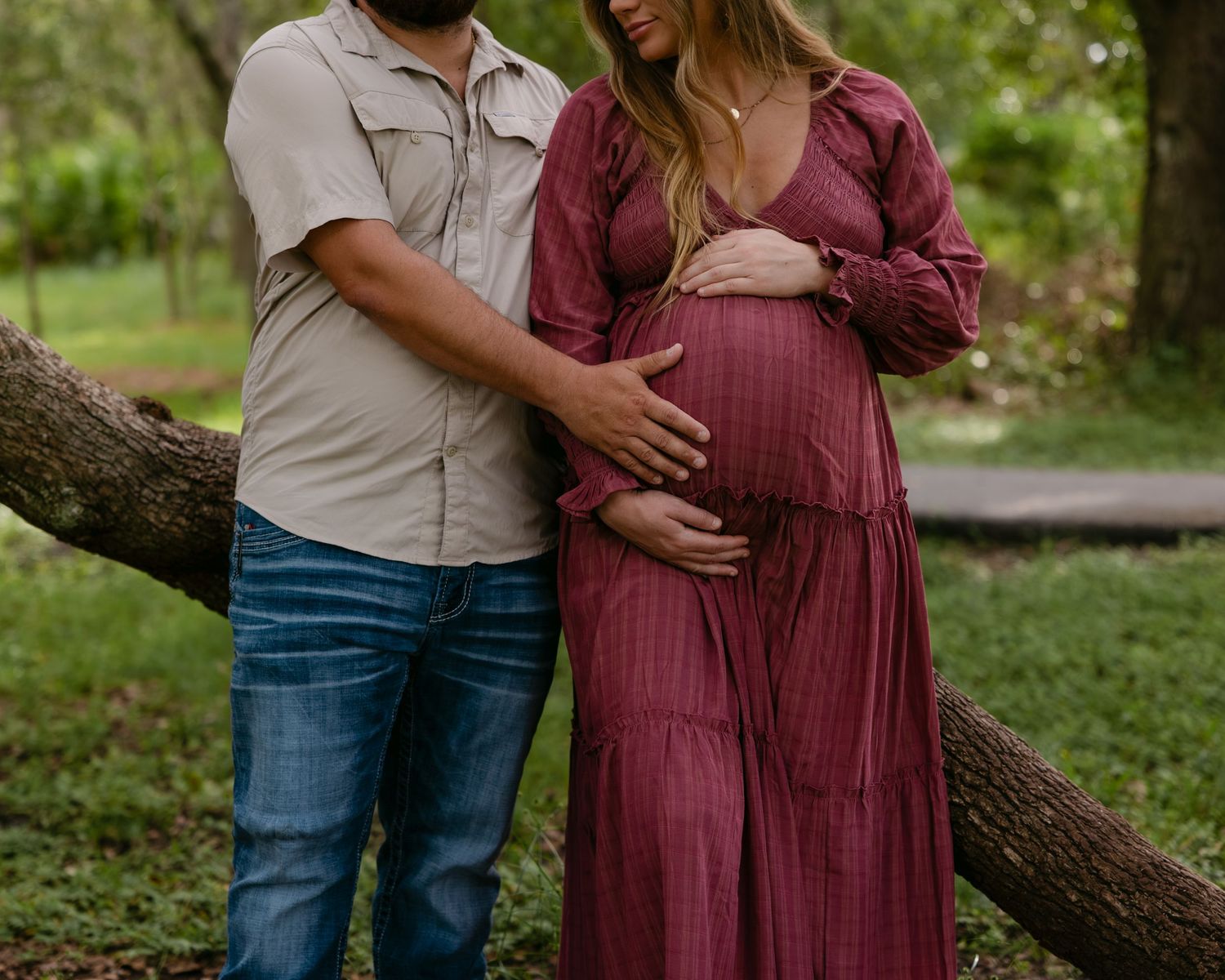 Fort Myers maternity session with Eric and Taylor captured in warm golden light and natural, candid family moments.