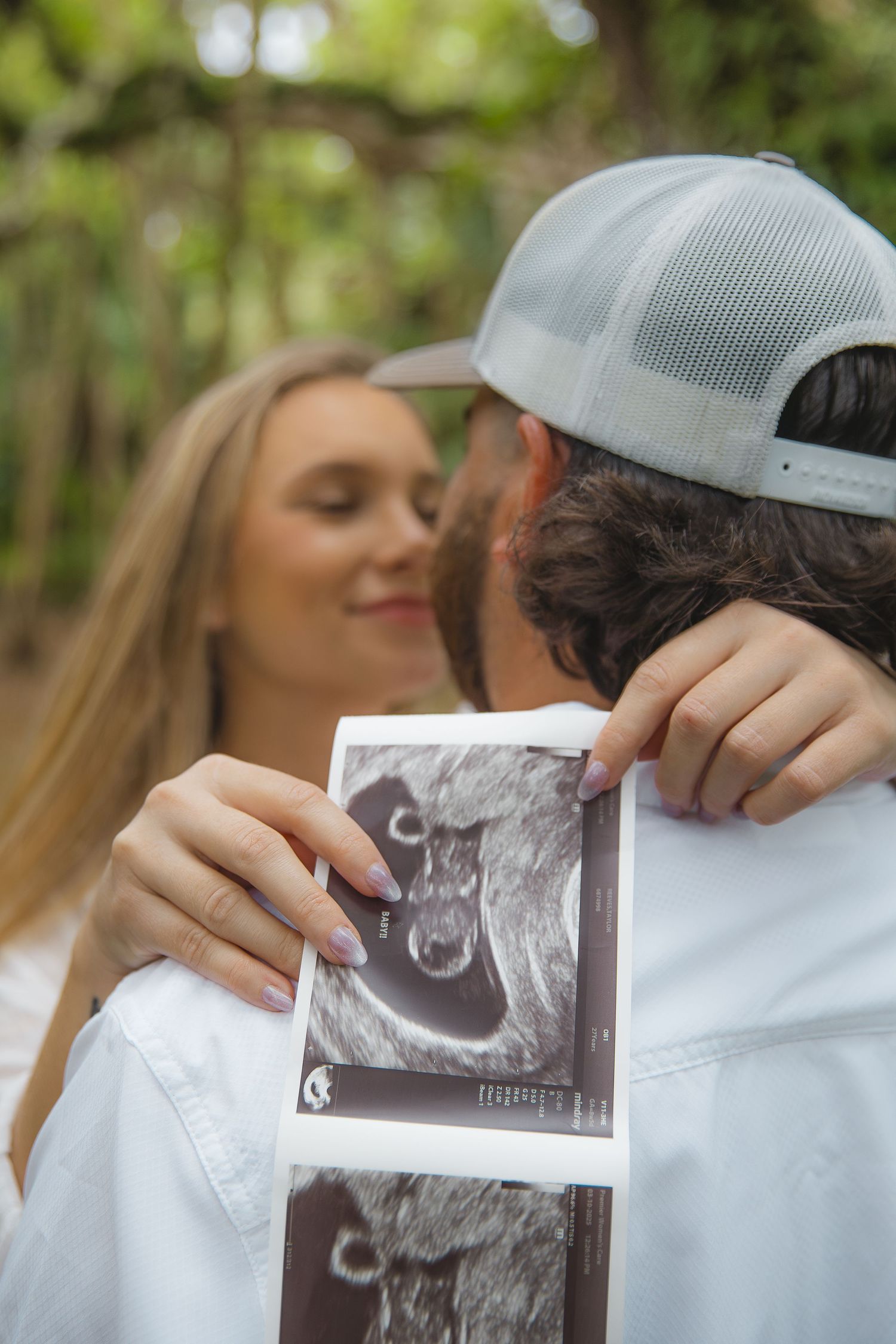 Candid Fort Myers maternity photography of Eric and Taylor celebrating parenthood with soft, natural light and warm tones.