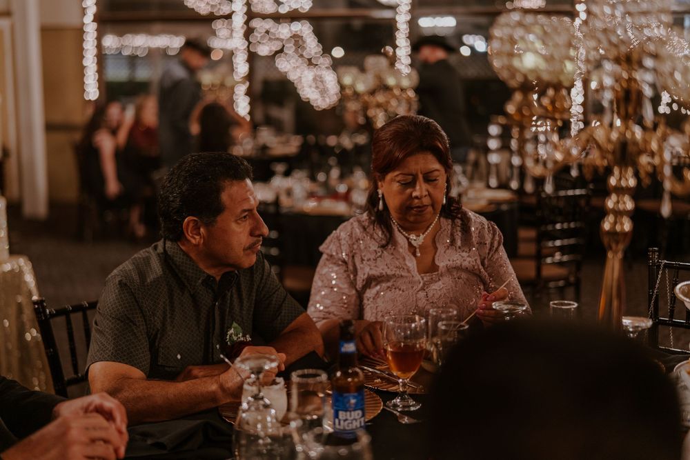 Evening dining scene with crystal chandeliers and intimate table conversation.