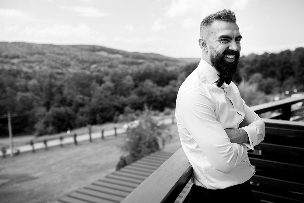 A black and white photo series shows someone in a white shirt sitting at a piano in an outdoor setting.