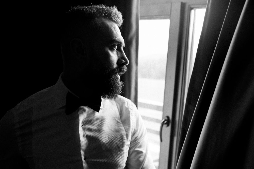 A series of black and white profile silhouettes showing different angles of a person's head against a window.
