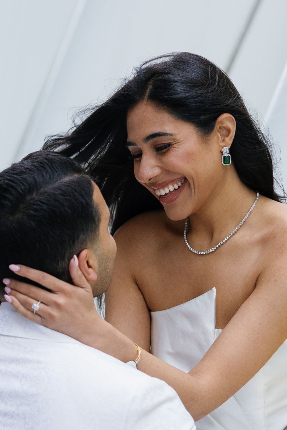 A romantic series of photos showing a couple in white embracing and sharing intimate moments together.