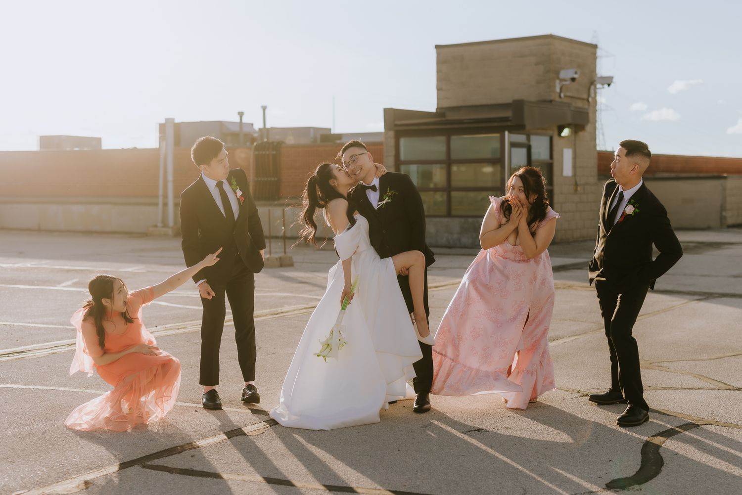 Fun, staged wedding party photo, showcasing gentle guidance and multi-cultural joy. Toronto Asian wedding photography.