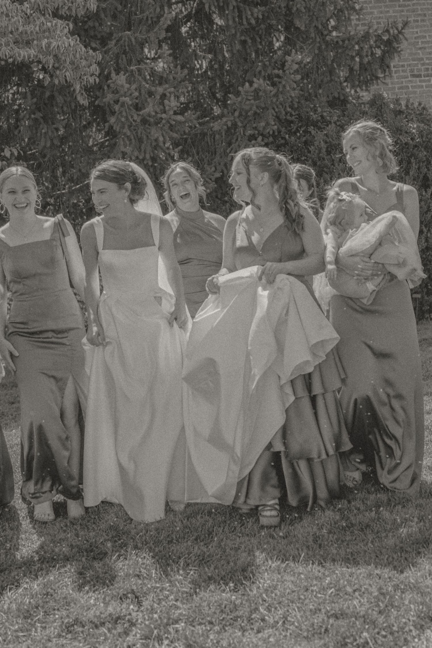 Bride with bridesmaids getting ready at Heritage Hill B&B, Waynesboro, VA, candid film and digital photography.